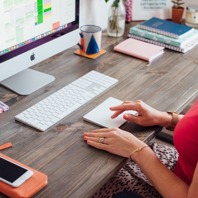 Kellie-Simpson-VA-Virtual-Assistant-Legal-Support-Web-18 girl sat at computer using tracker pad