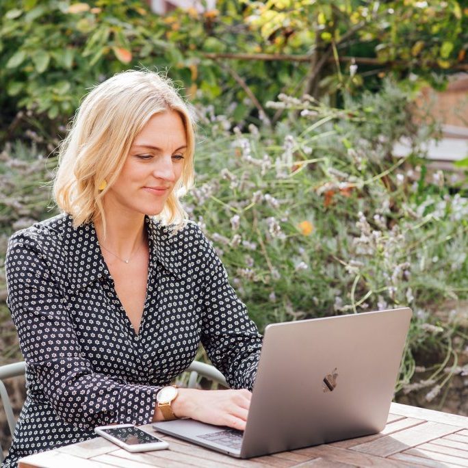 Kellie-Simpson-VA-Virtual-Assistant-Legal-Support-Web-324 Woman sat at table on laptop